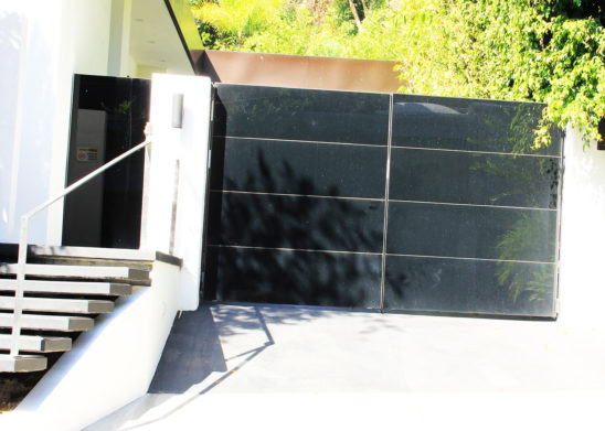 custom contemporary black glass bifold auto gate