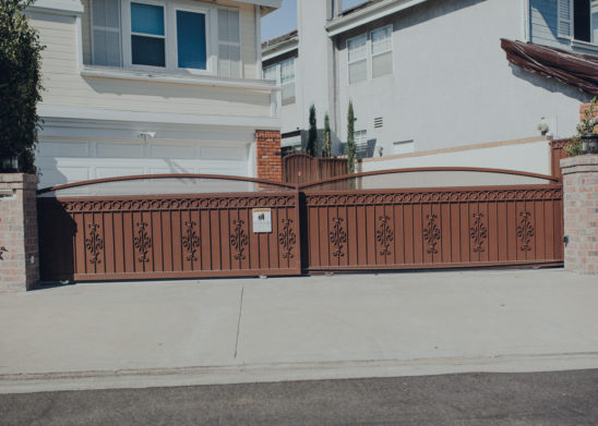 Dual-Steel-Slide-Gates-With-Decorative-Scroll-Work-And-Privacy-Backing Los Angeles, Orange County