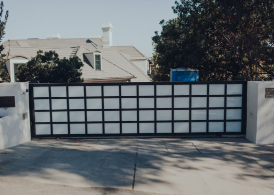 Steel Sliding Gate with Inset White Laminated Glass Panels - Los Angeles, Orange County